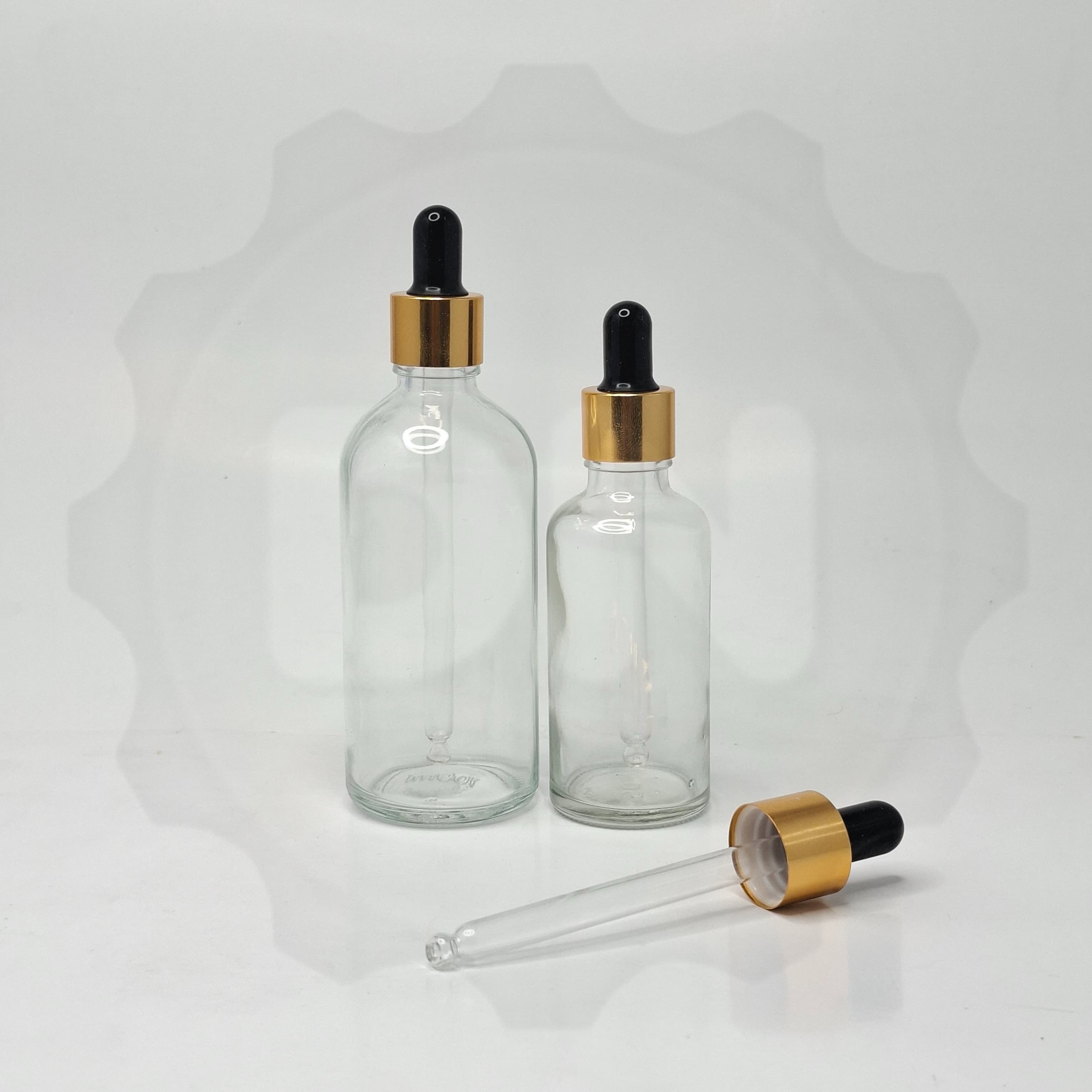 Main image of Clear Glass Serum Bottle - Gold / Black
