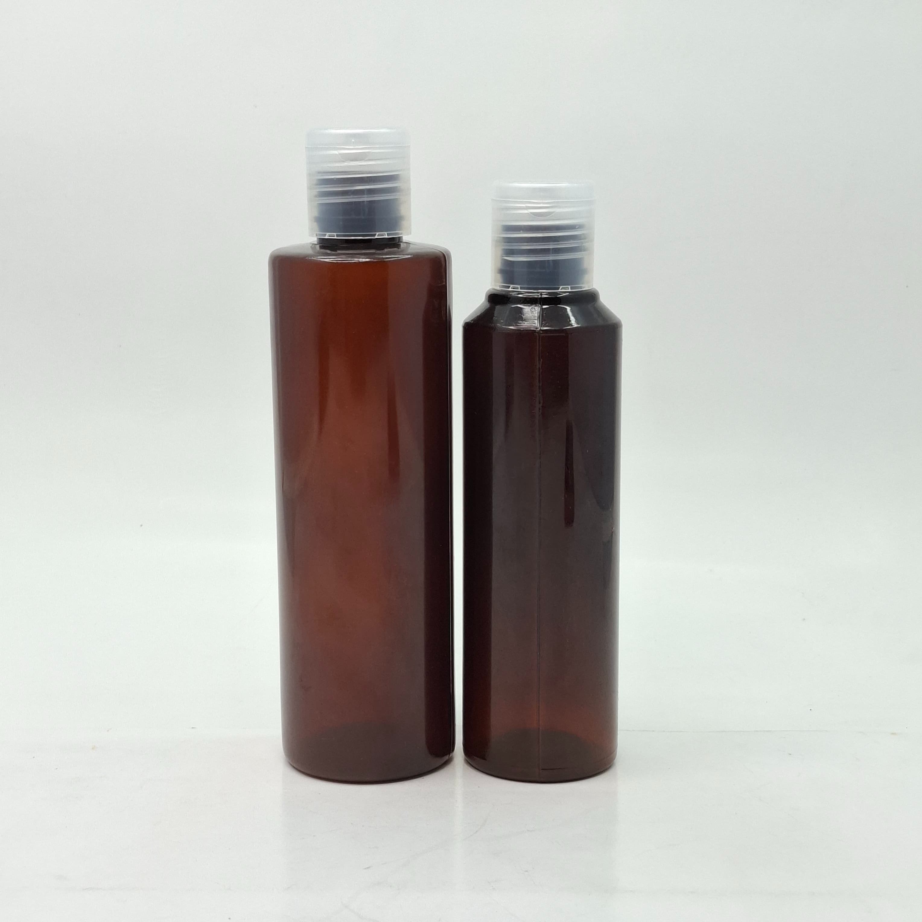 Main image of Round Amber Bottle - Flip Top Lids Clear