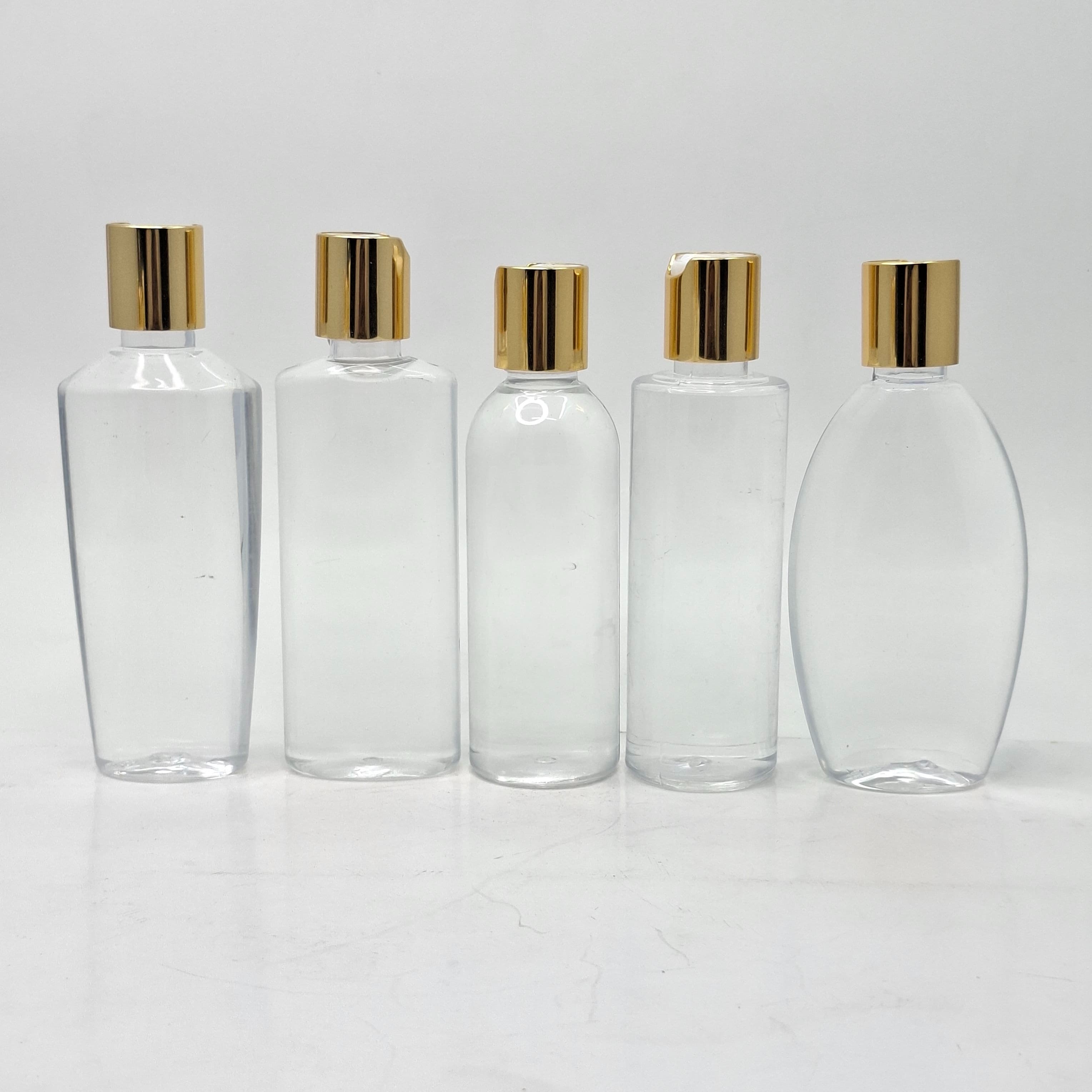 Thumbnail 2 of 100ml Ovel Bottle Clear - Press Lid Gold 
