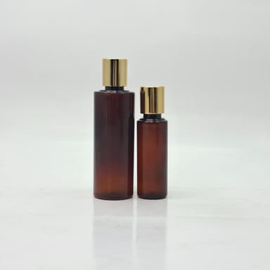 Amber Round Bottle - Press Cap Gold