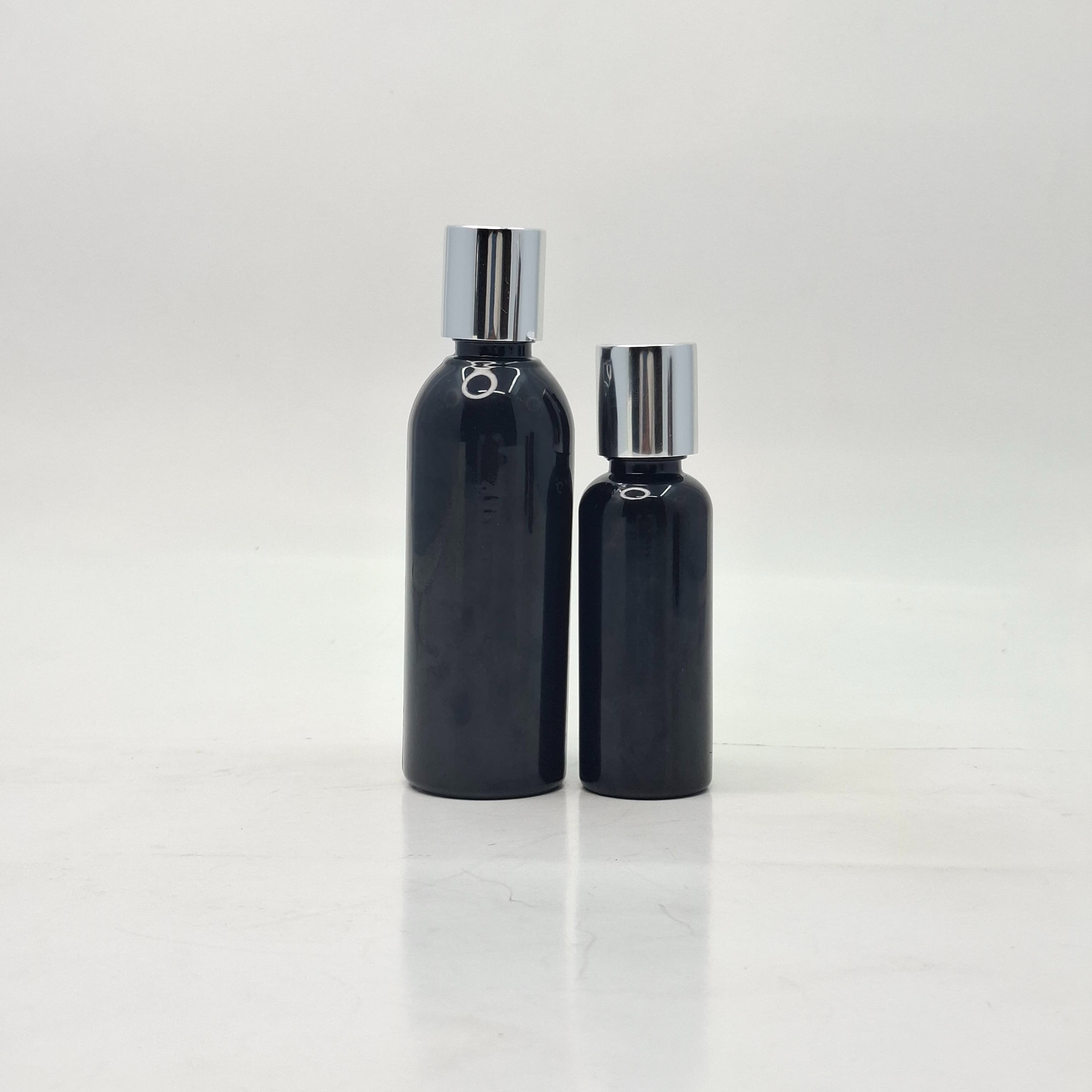 Main image of Round Black Bottle - Press Cap Silver