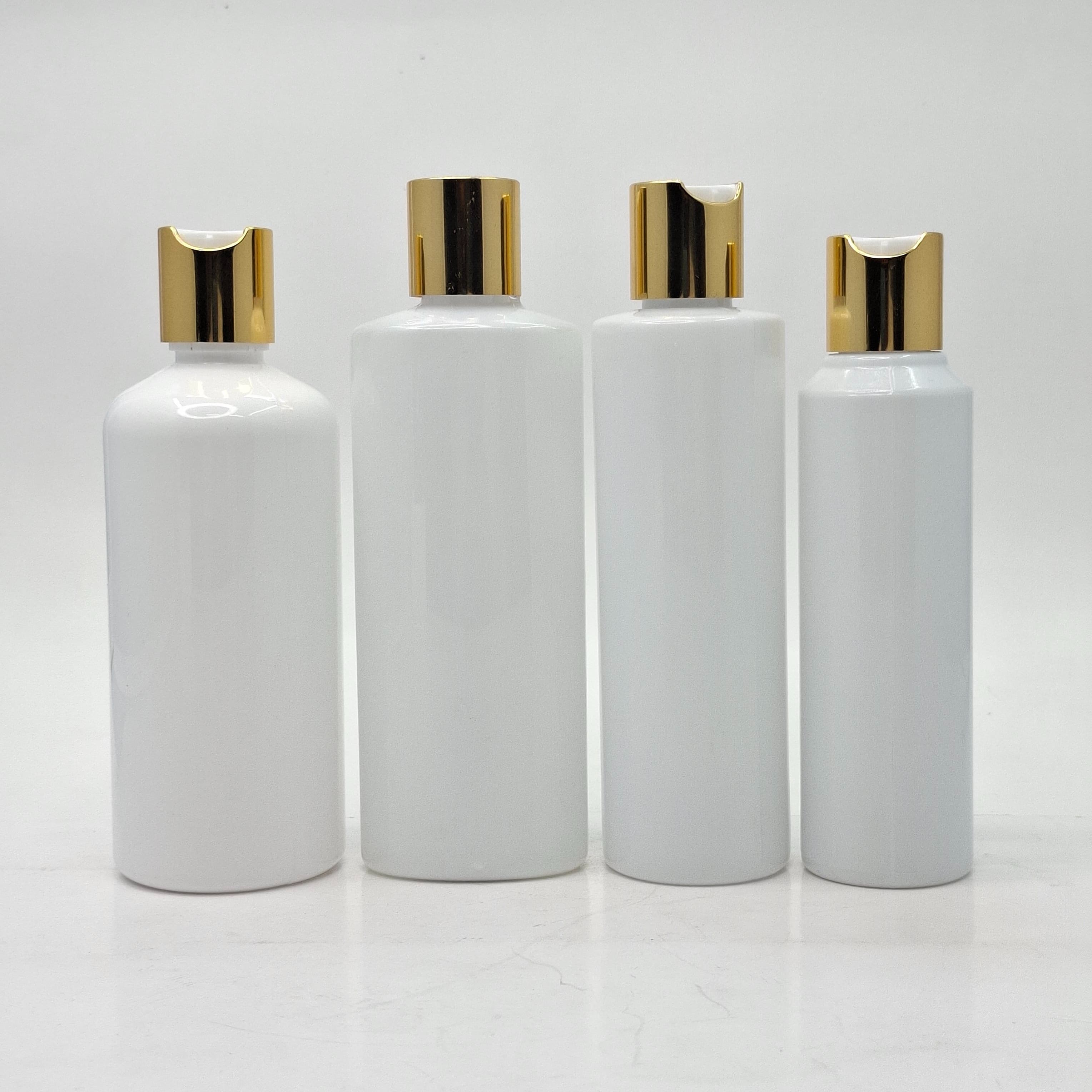 Main image of Round Milk White Bottle - Press Cap Gold