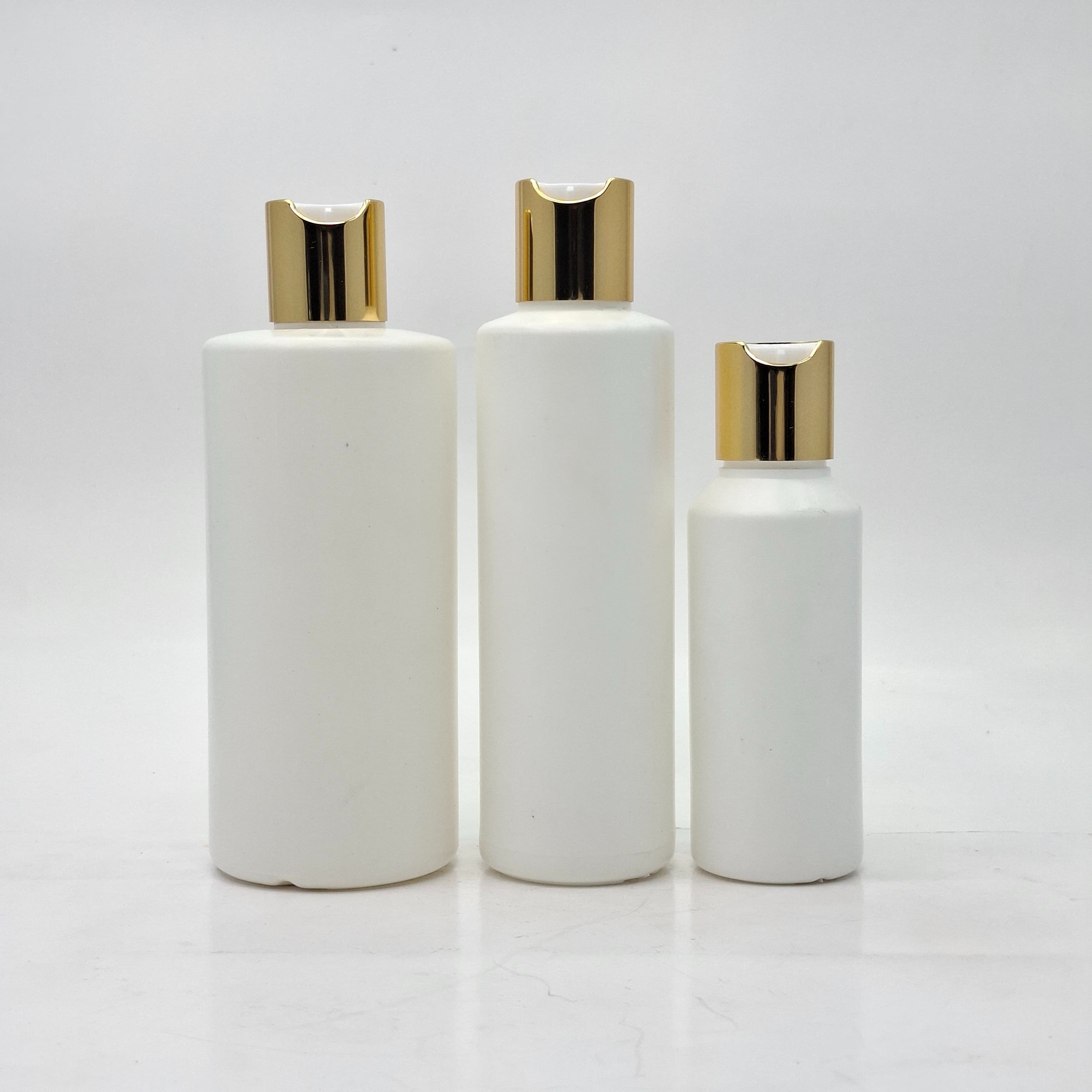 Main image of Round HDPE White Bottle - Press Lid Gold