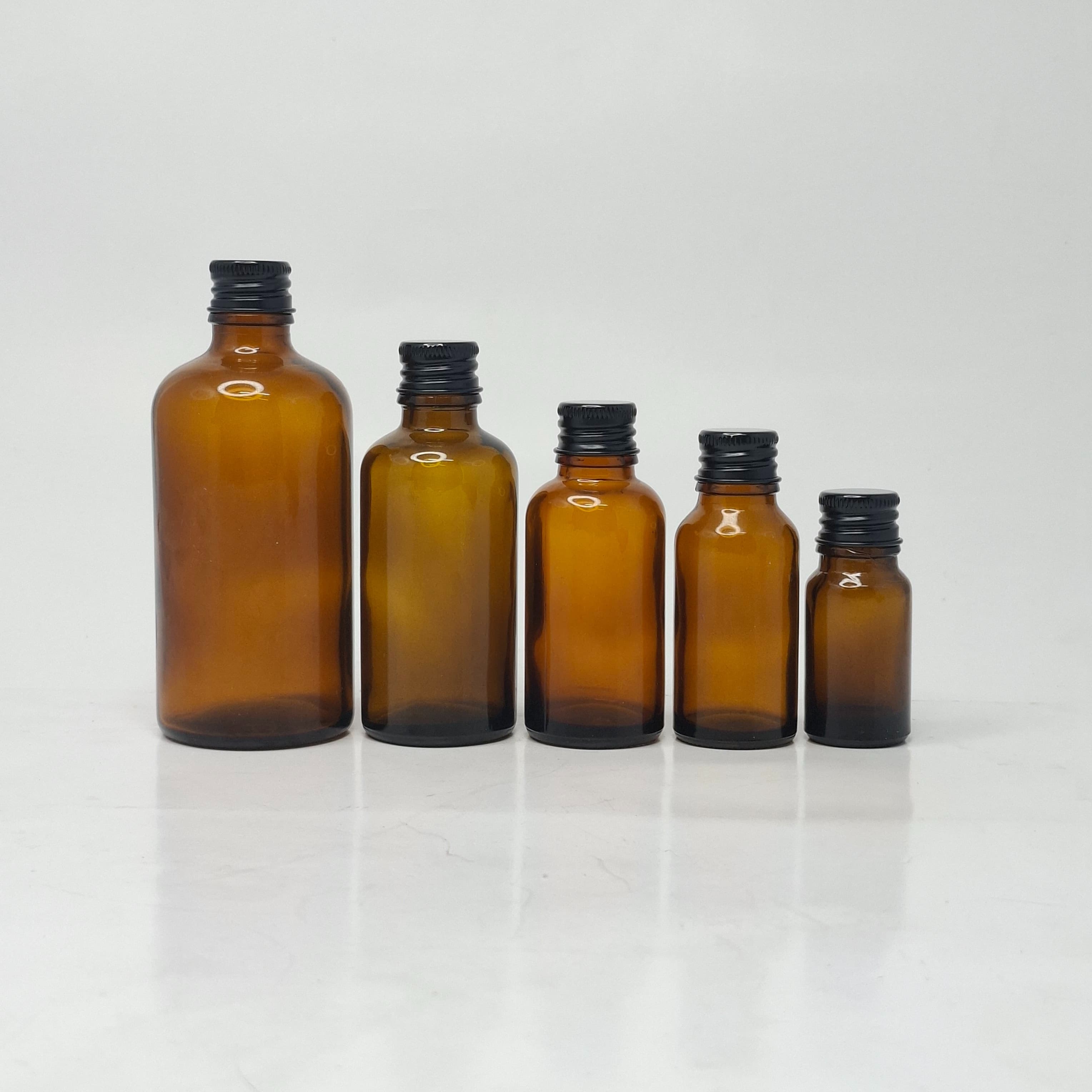 Main image of 10ml-100ml Amber Glass Bottle - Alu Cap Black 