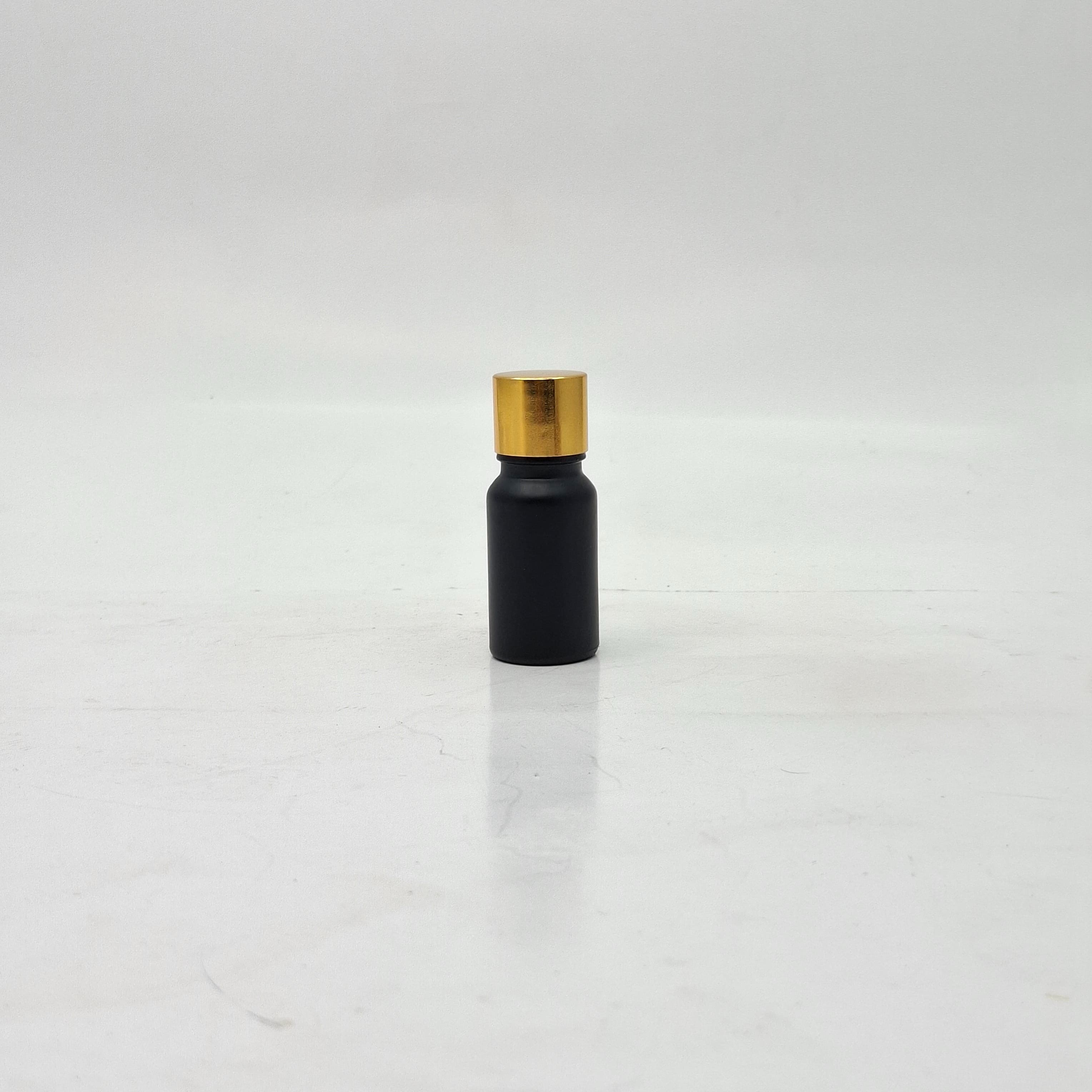 Main image of 10ml Black Glass Bottle -18mm Shine Gold Lid with insert