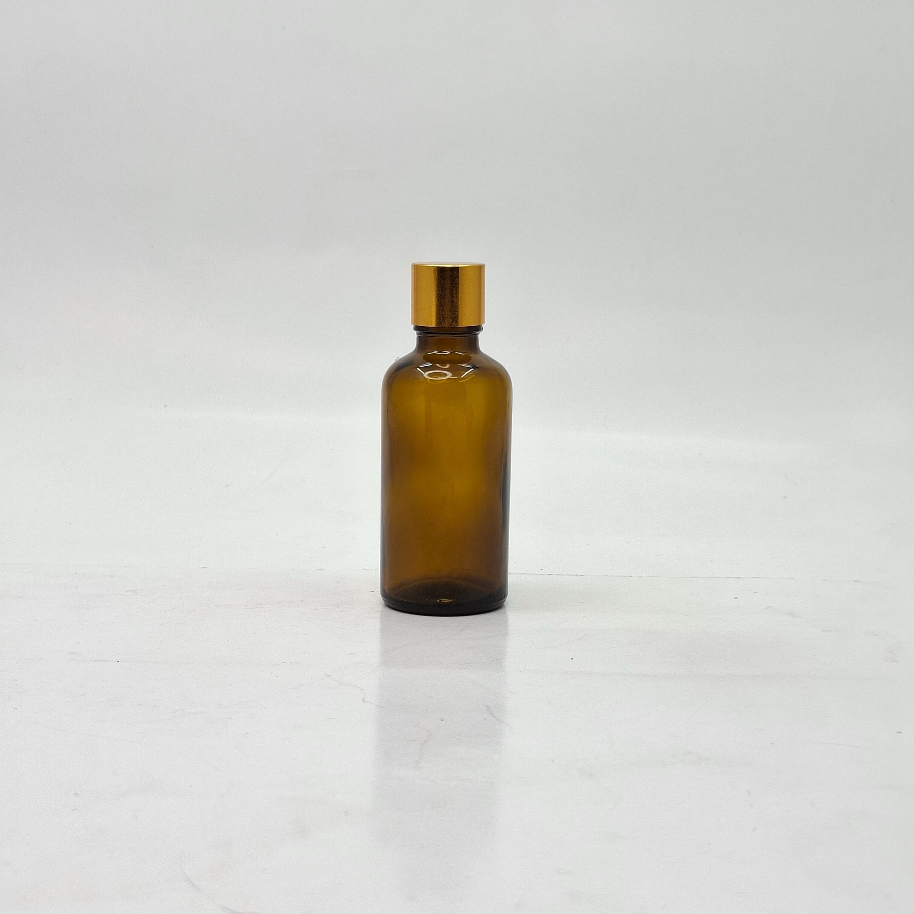 Main image of 50ml Amber Glass Bottle -18mm Shine Gold Lid with insert
