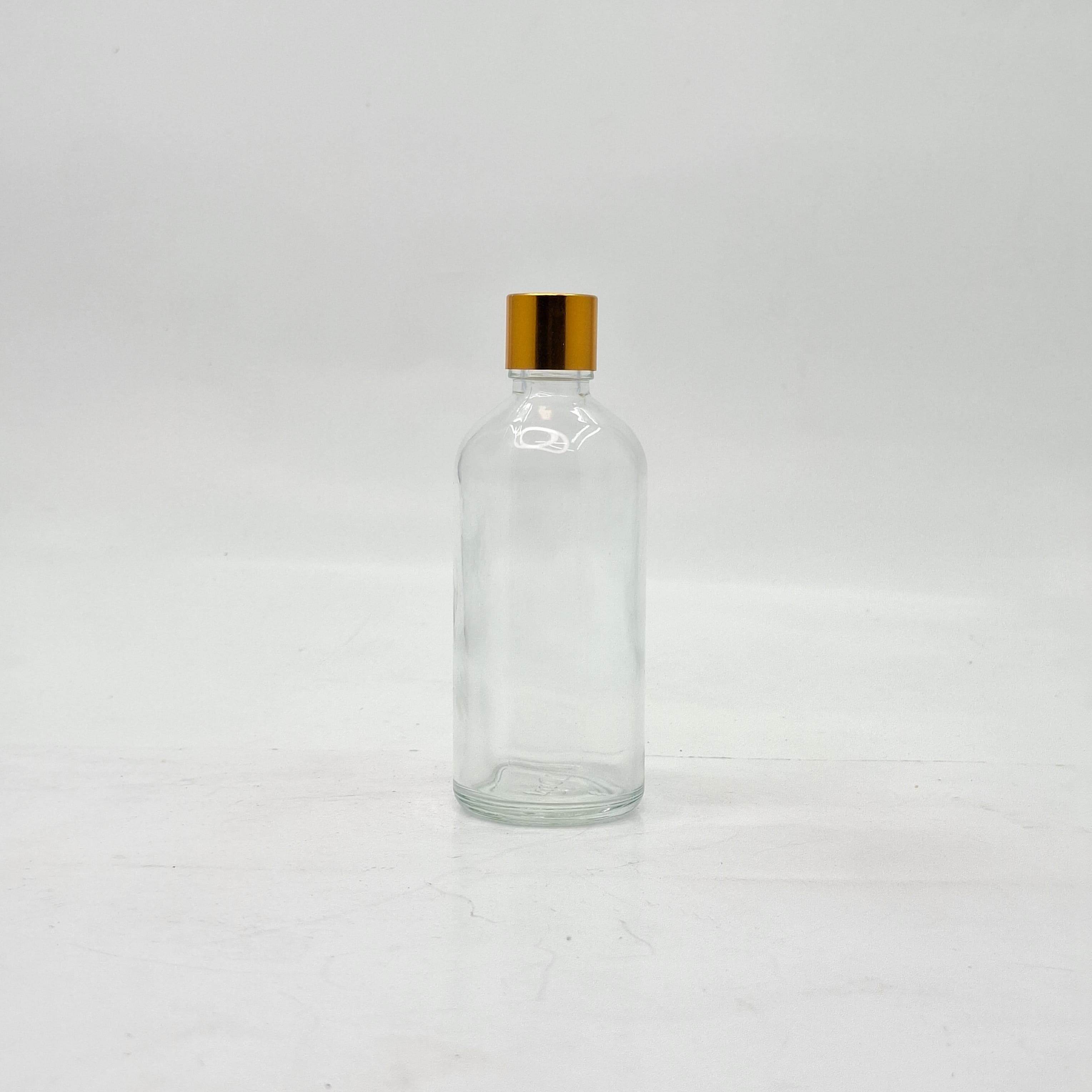 Main image of 100ml Clear Glass Bottle -18mm Shine Gold Lid with insert