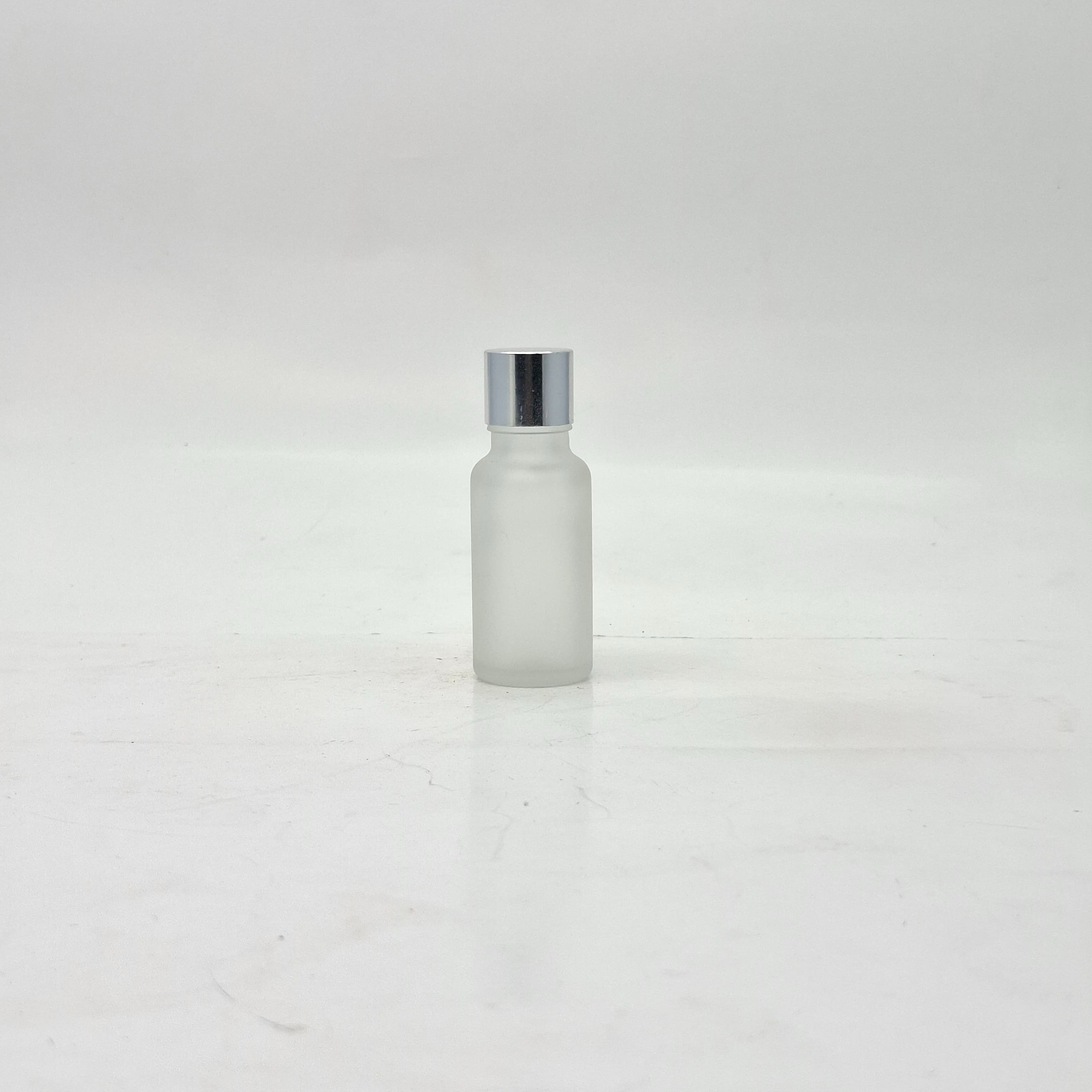 Main image of 20ml Frosted Glass Bottle -18mm Shine Silver Lid with insert