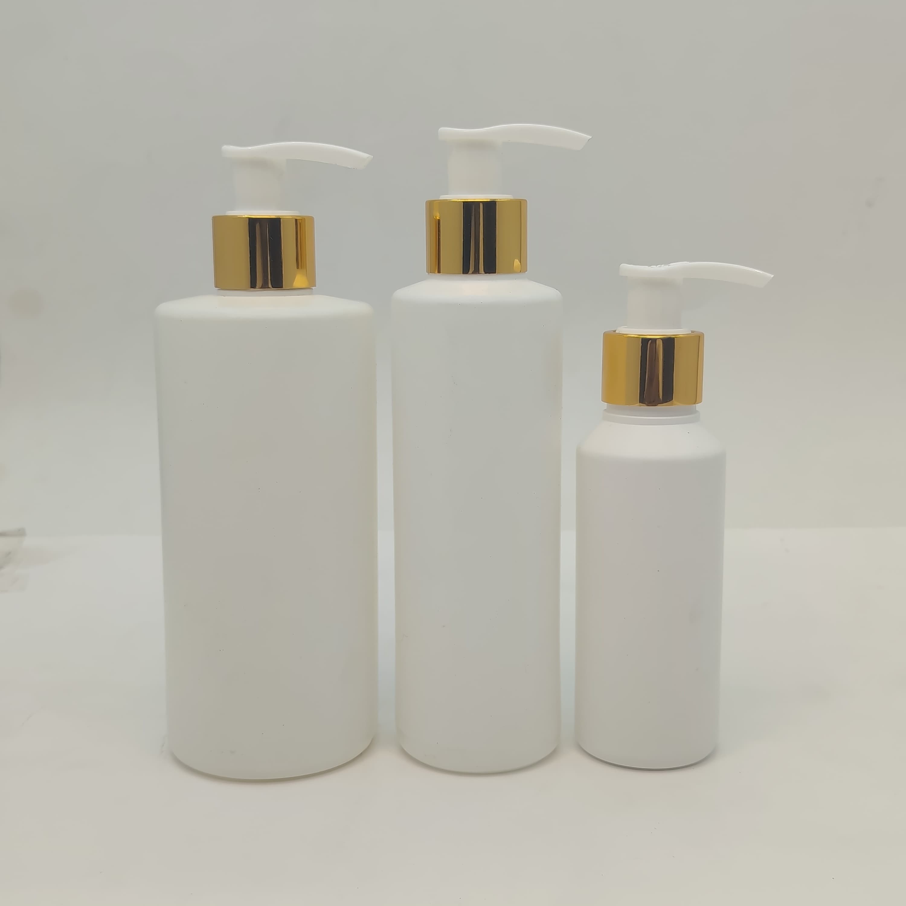 Main image of 100ml-340ml HDPE White Bottle- Gold White Pump