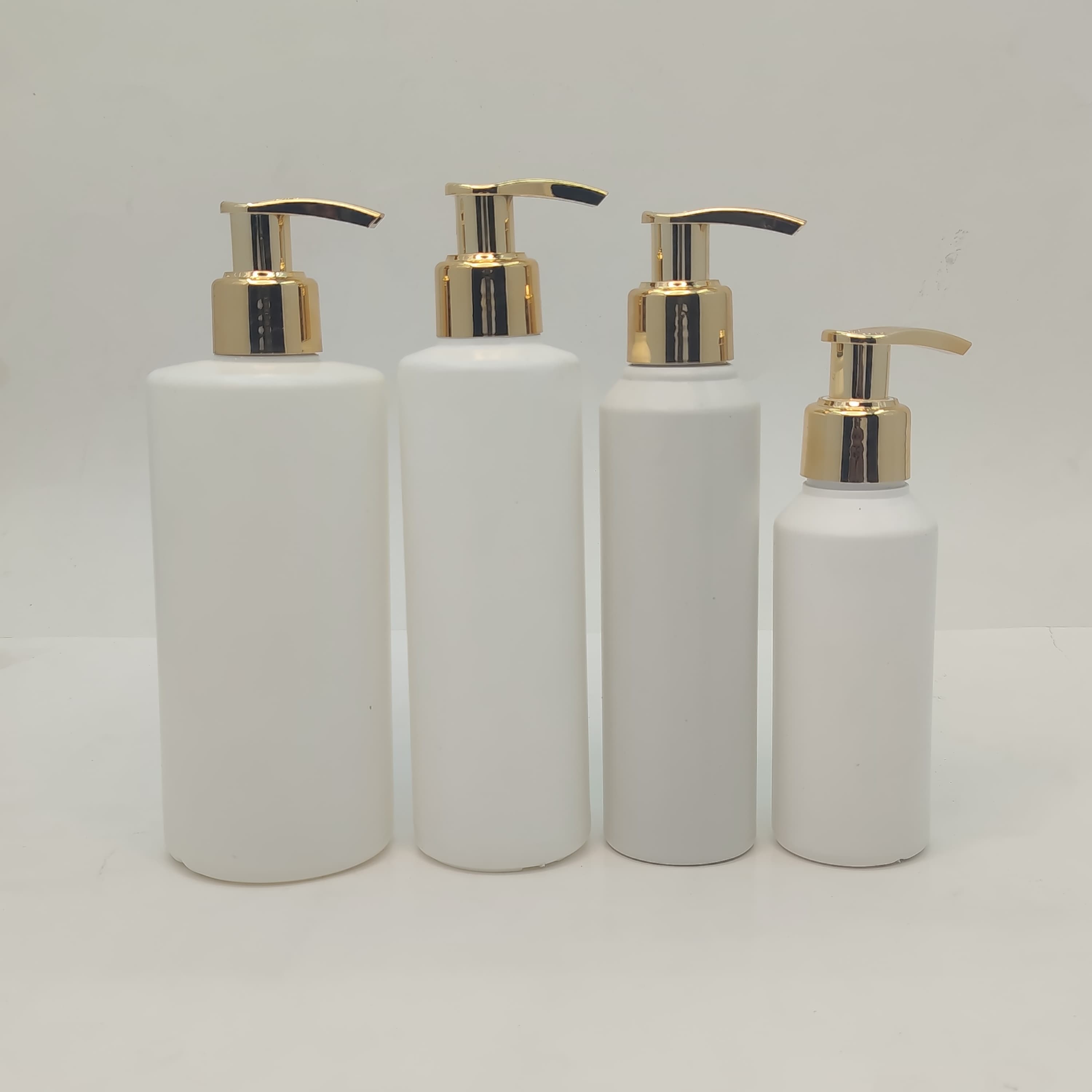Main image of 100ml-340ml Round HDPE White Bottle - Gold Pump
