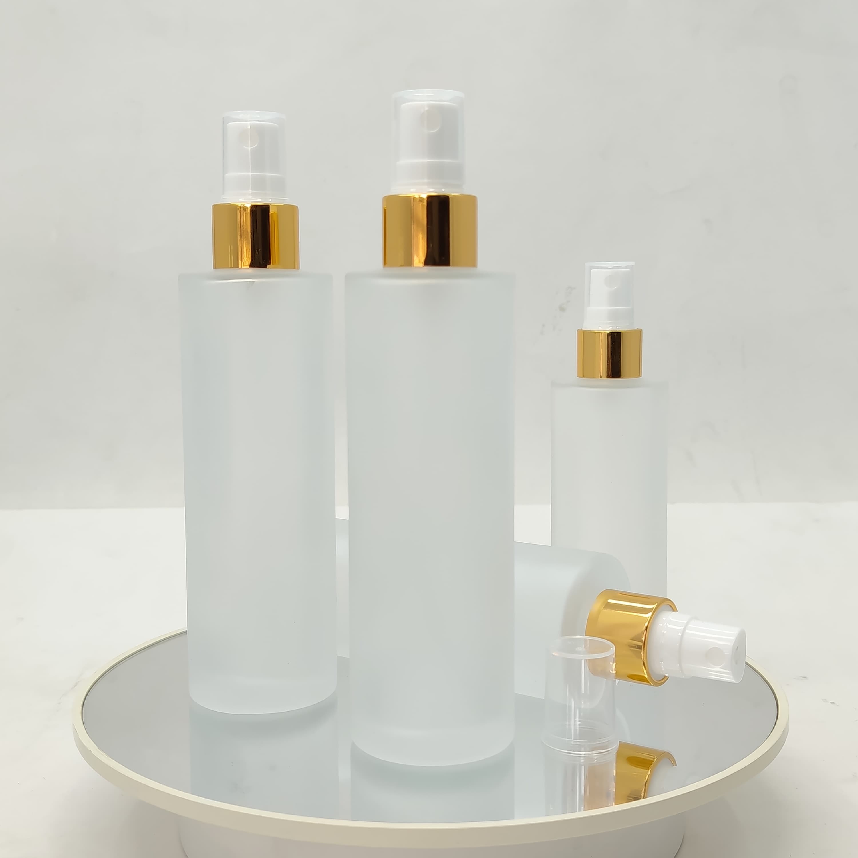 Main image of 100ml Frosted Glass Bottle - Gold Sprayer 
