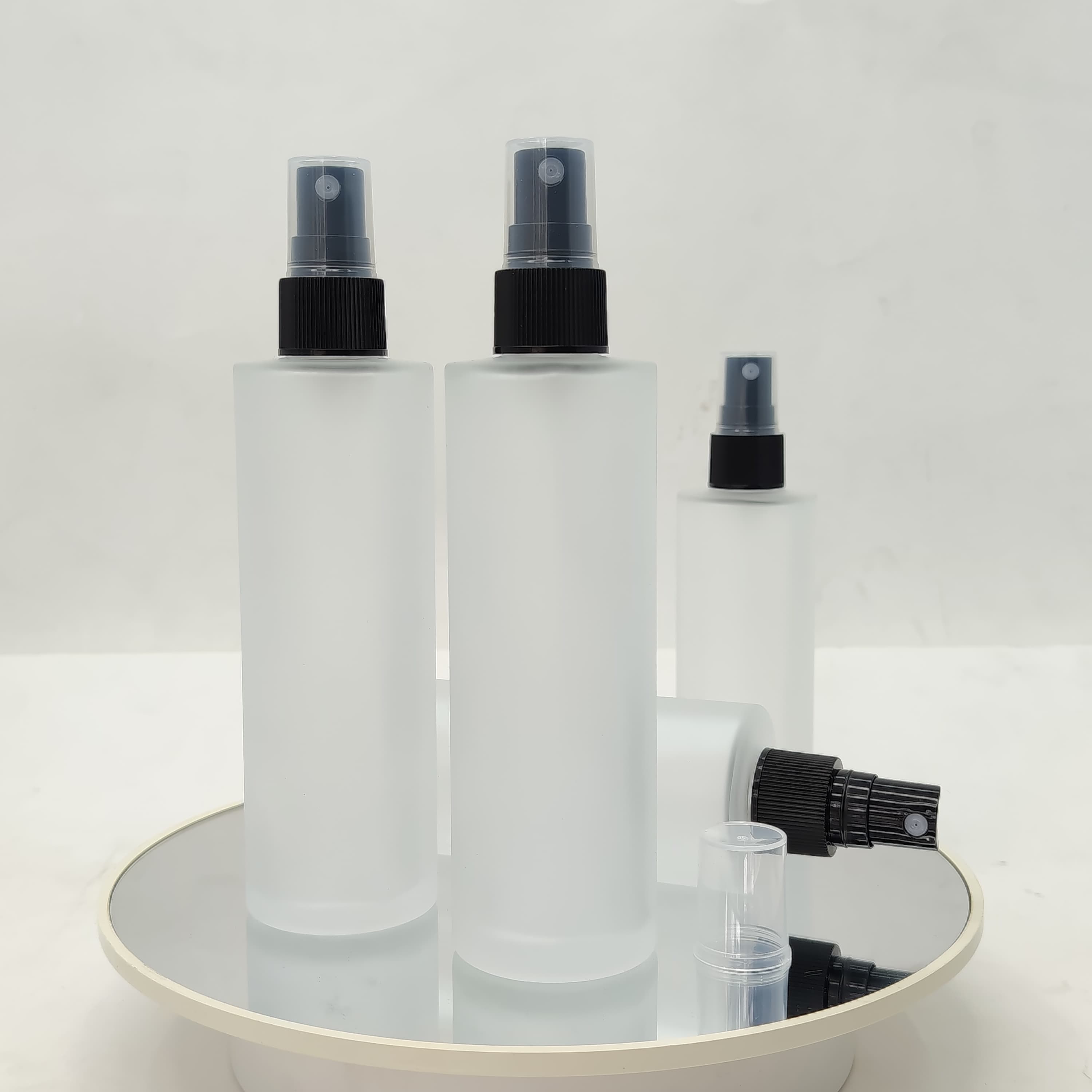 Main image of 100 ml Frosted Glass Bottle - Black Sprayer 