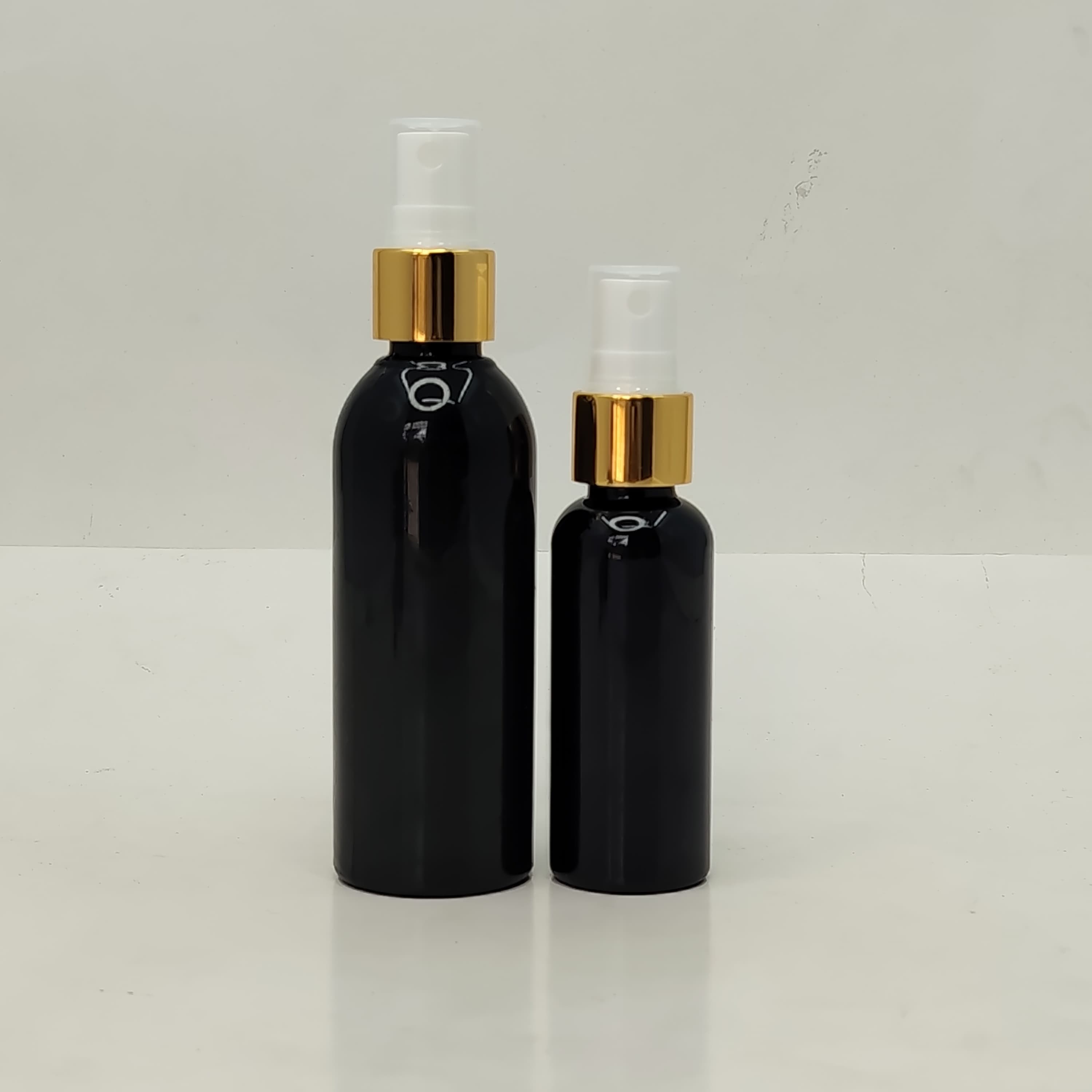 Main image of 50ml-100ml Round Bottle Black - Gold Spray