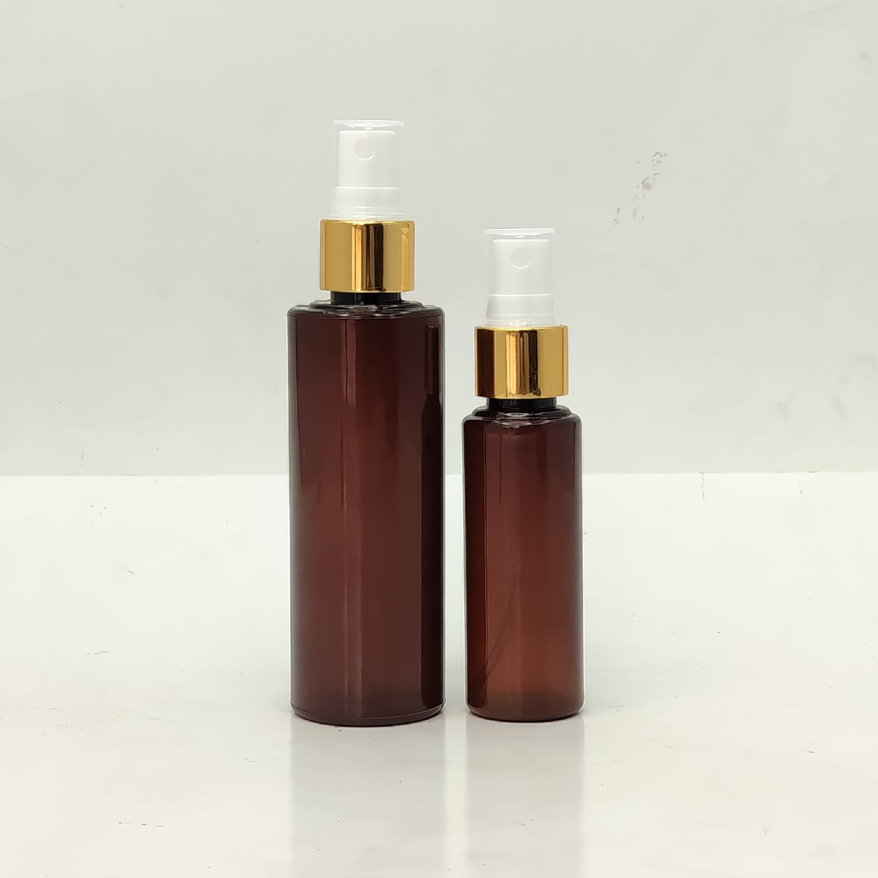 Main image of 50ml-100ml Round Bottle Amber - Gold Spray
