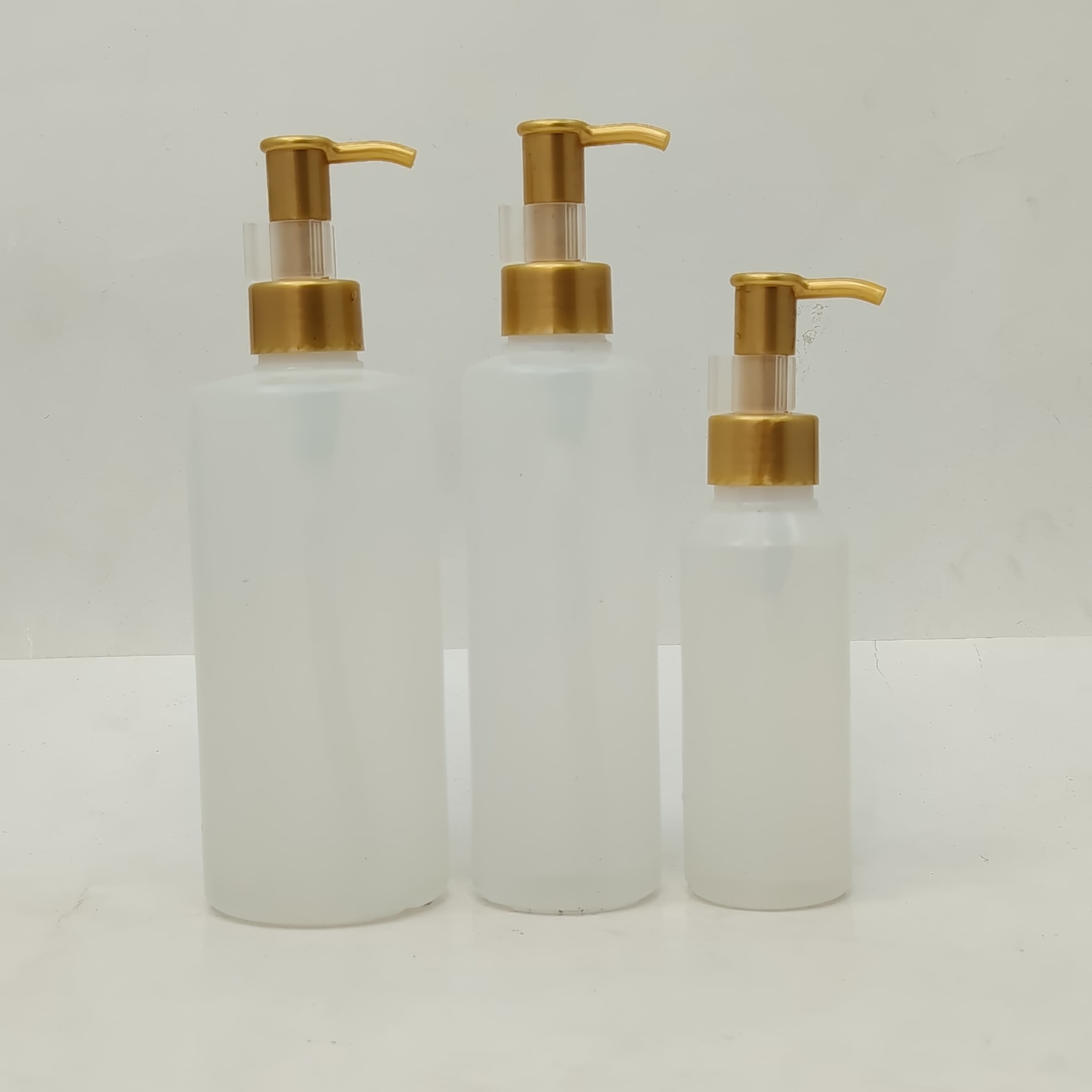 Main image of 100ml-340ml HDPE Clear Bottle - Gold Cream Pump-Long Neck