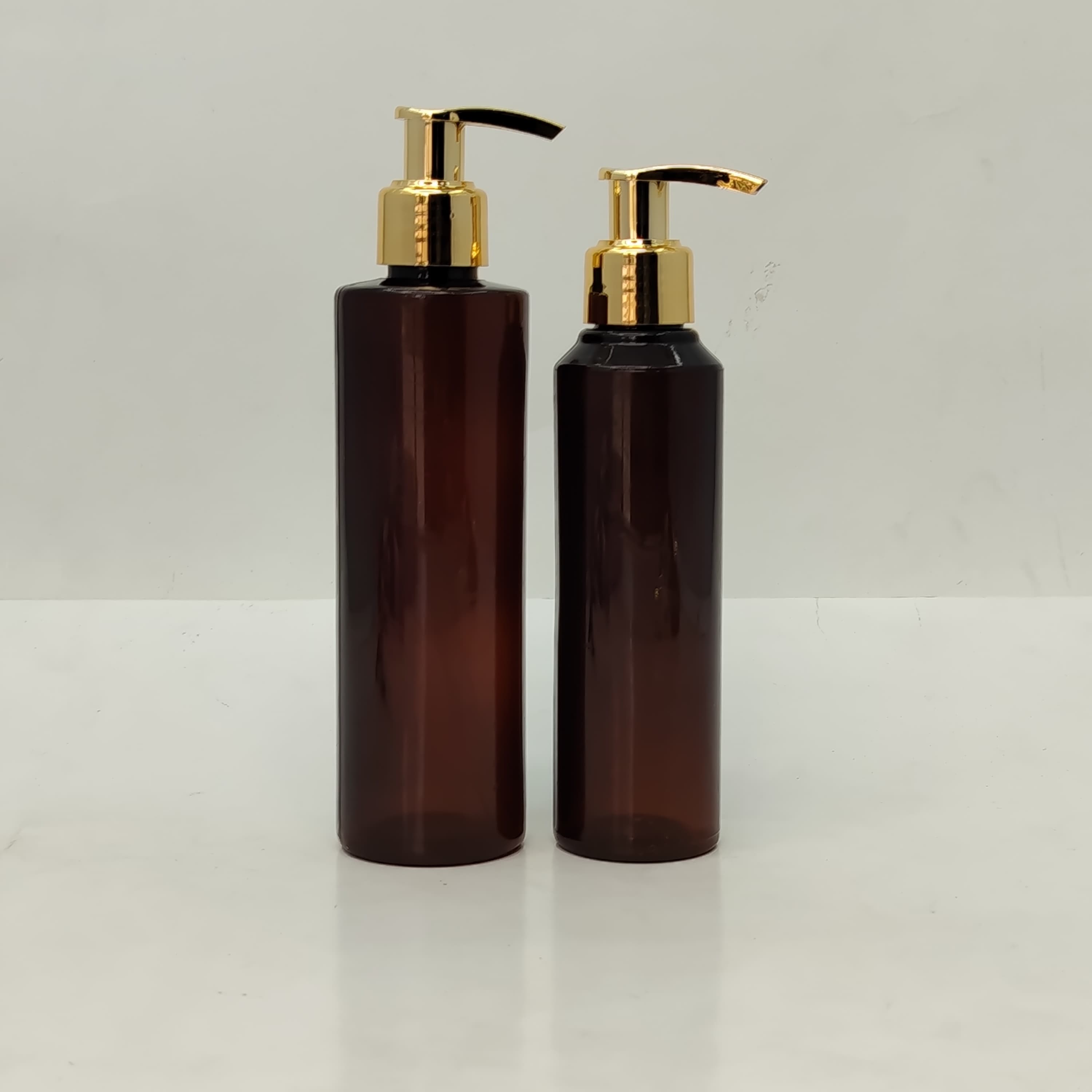 Main image of 150ml-200ml Round Amber Bottle - Gold Pump