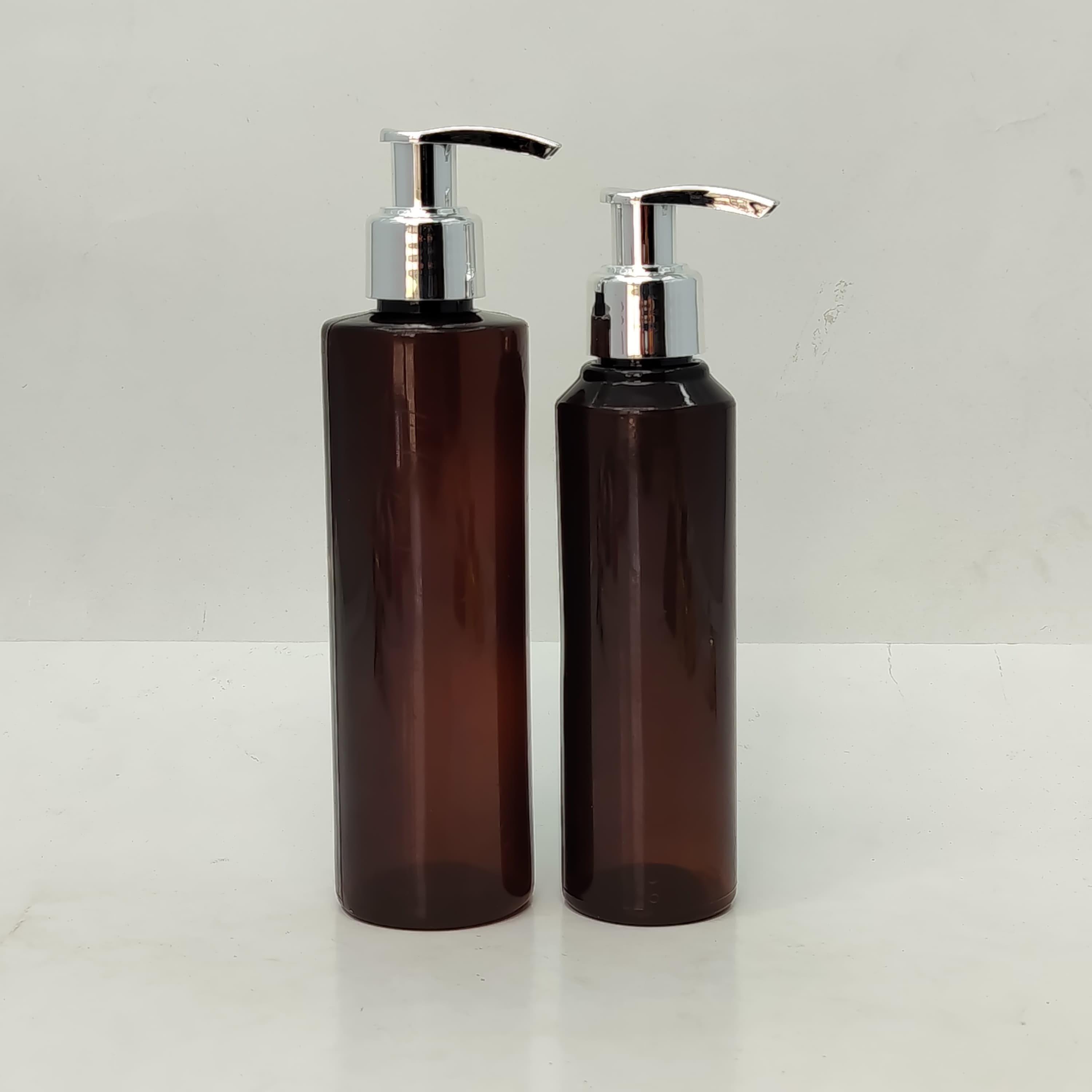 Main image of 150ml-200ml Round Amber Bottle - Silver Pump